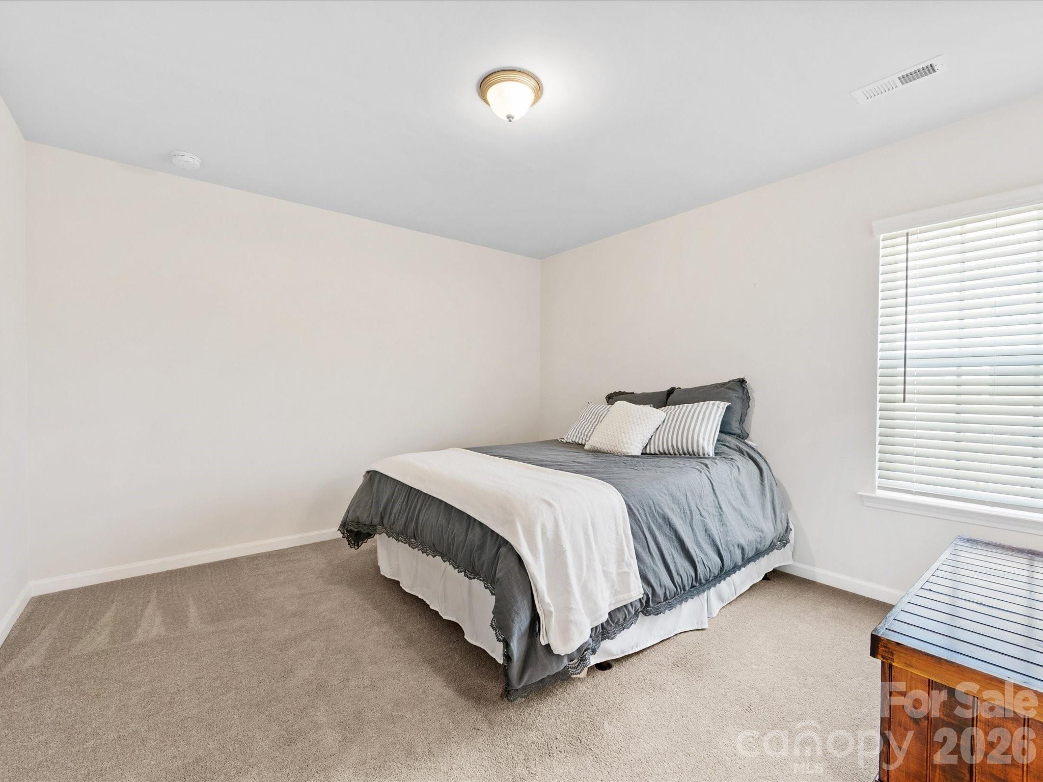 4261 Coachwhip Avenue Lancaster, SC 29720 - Photo 31 of 42 a bedroom with a bed and a window