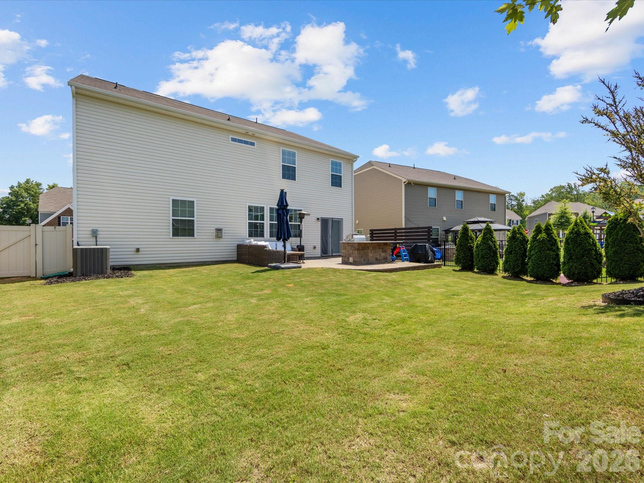 4261 Coachwhip Avenue Lancaster, SC 29720 - Photo 36 of 42 a view of a house with a swimming pool and a yard