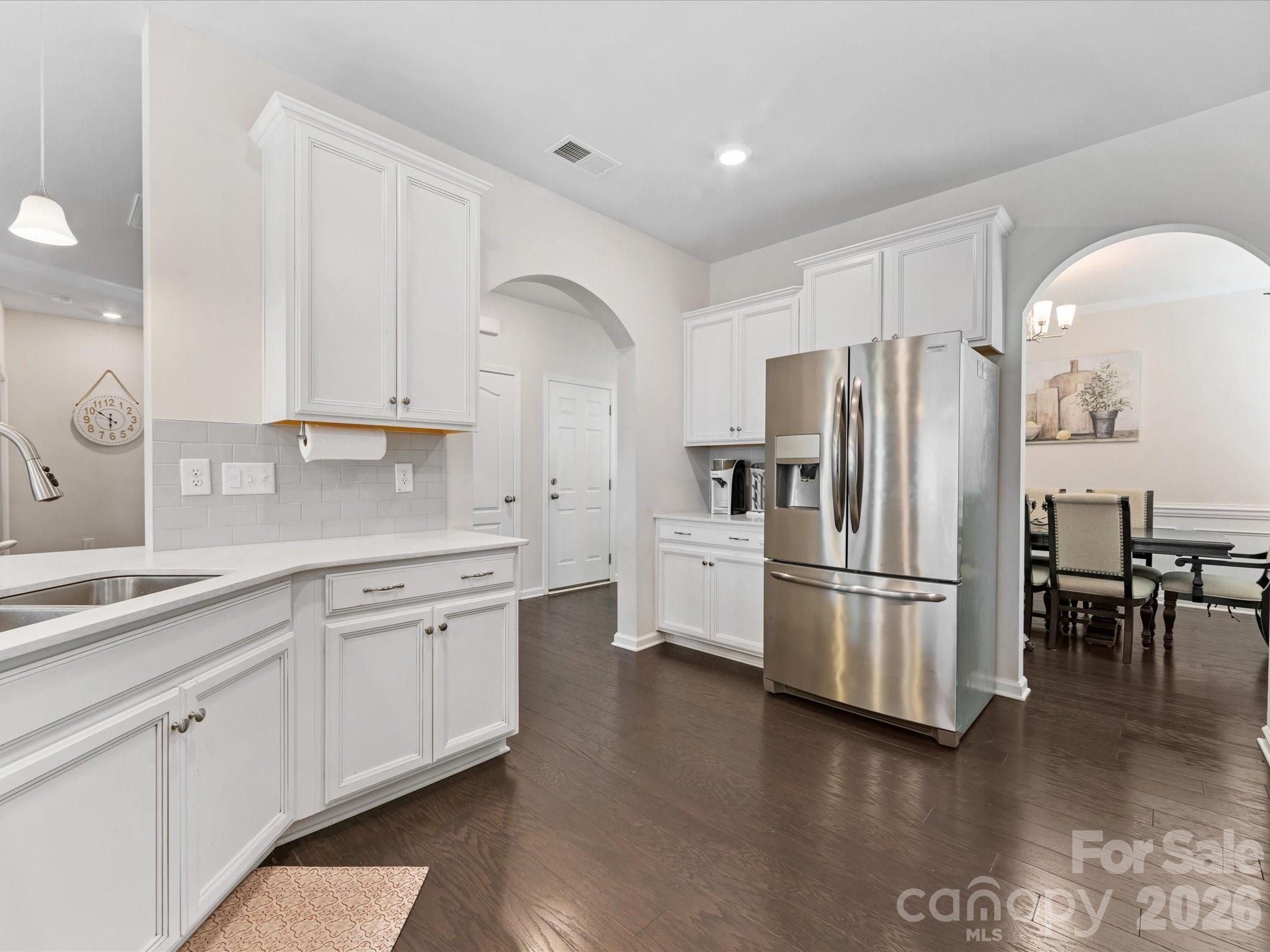 4261 Coachwhip Avenue Lancaster, SC 29720 - Photo 5 of 42 a kitchen with stainless steel appliances a refrigerator sink and cabinets