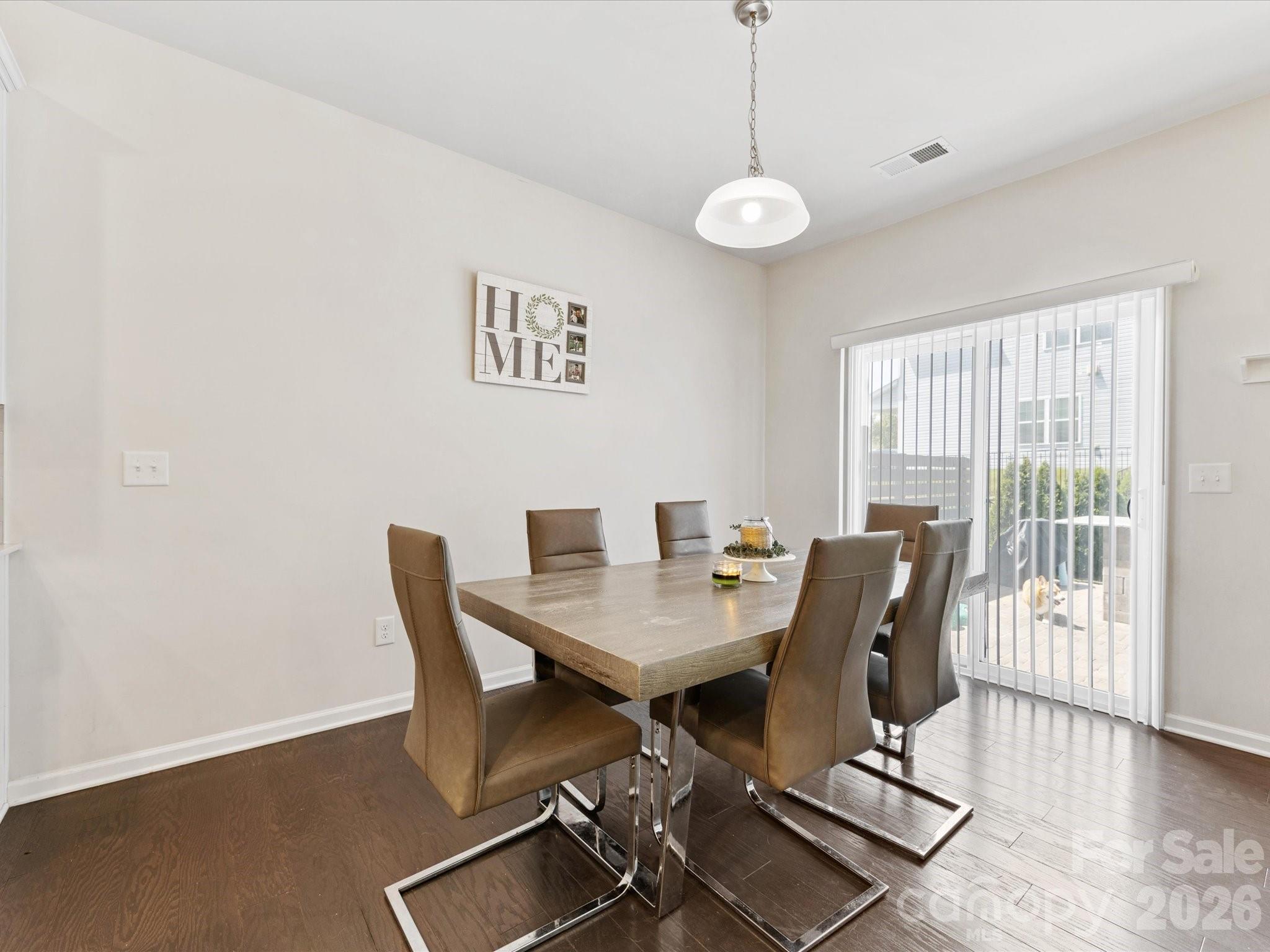 4261 Coachwhip Avenue Lancaster, SC 29720 - Photo 7 of 42 a view of a dining room with furniture and wooden floor