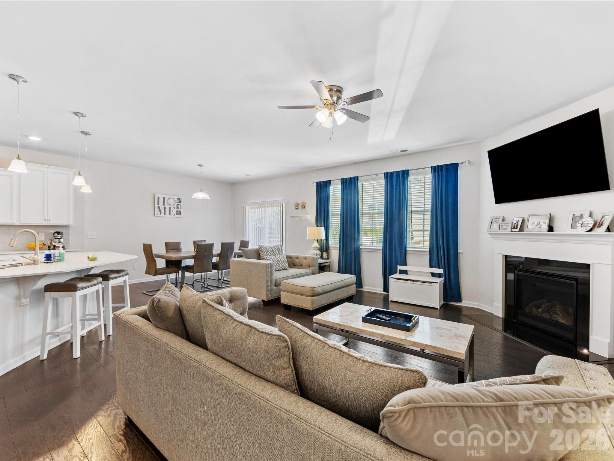 4261 Coachwhip Avenue Lancaster, SC 29720 - Photo 10 of 42 a living room with furniture fireplace and a flat screen tv