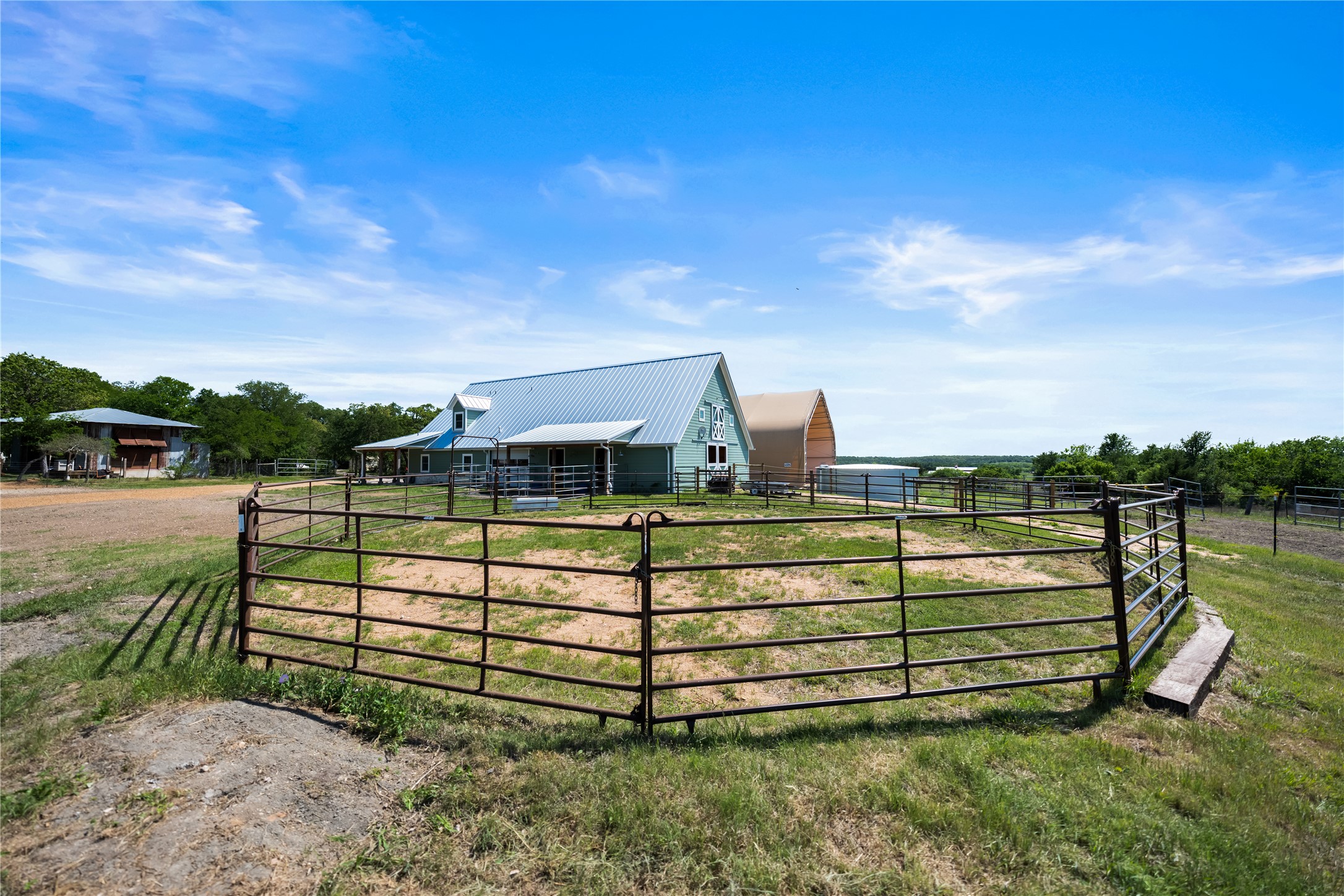 7670 Nez Perce Trace Manor, TX 78653 - Photo 36 of 40 View of gate featuring an exterior structure, a rural view, and an outbuilding