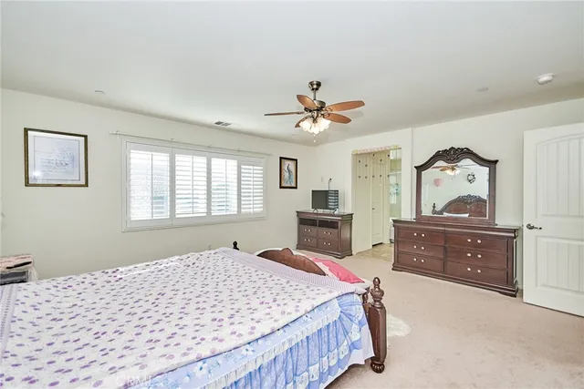 a bed room with a bed and a dresser