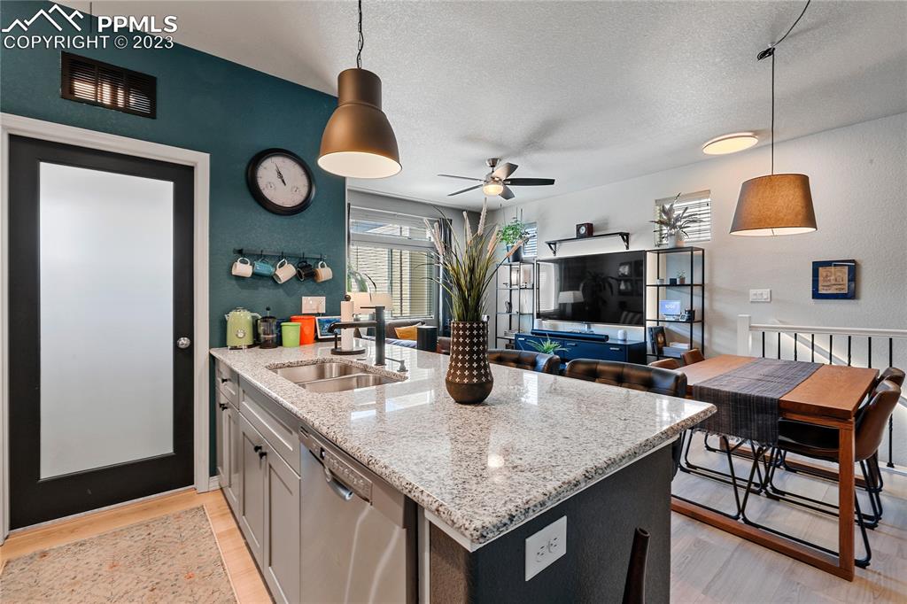 2016 Paddy Grove Colorado Springs, CO 80910 - Photo 12 of 39 a kitchen with a table and chairs in it