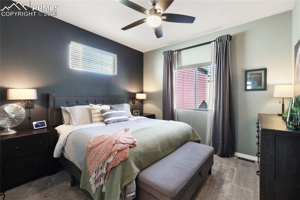 2016 Paddy Grove Colorado Springs, CO 80910 - Photo 21 of 39 a bedroom with bed and window