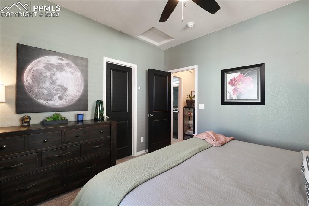 2016 Paddy Grove Colorado Springs, CO 80910 - Photo 22 of 39 a bedroom with a bed and a dresser
