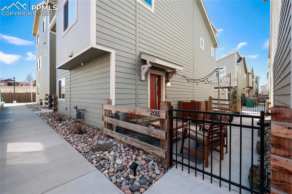 2016 Paddy Grove Colorado Springs, CO 80910 - Photo 3 of 39 a view of a house with backyard and sitting area