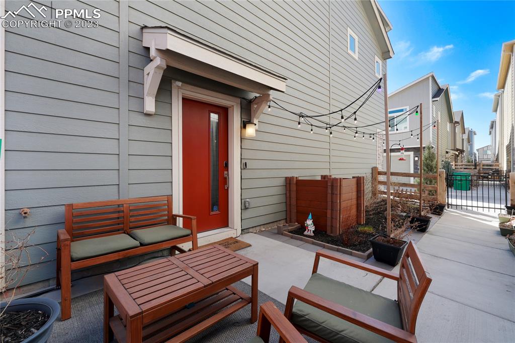2016 Paddy Grove Colorado Springs, CO 80910 - Photo 33 of 39 a view of a patio with a table and chairs