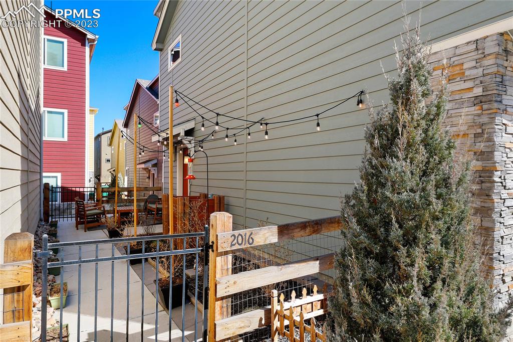 2016 Paddy Grove Colorado Springs, CO 80910 - Photo 34 of 39 a view of a house with a tree