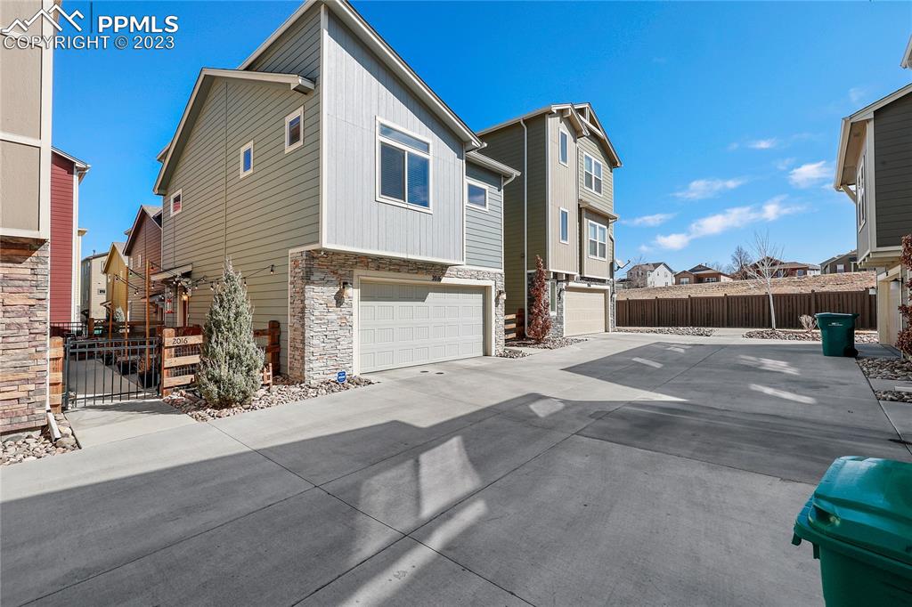 2016 Paddy Grove Colorado Springs, CO 80910 - Photo 38 of 39 a front view of a house with a yard