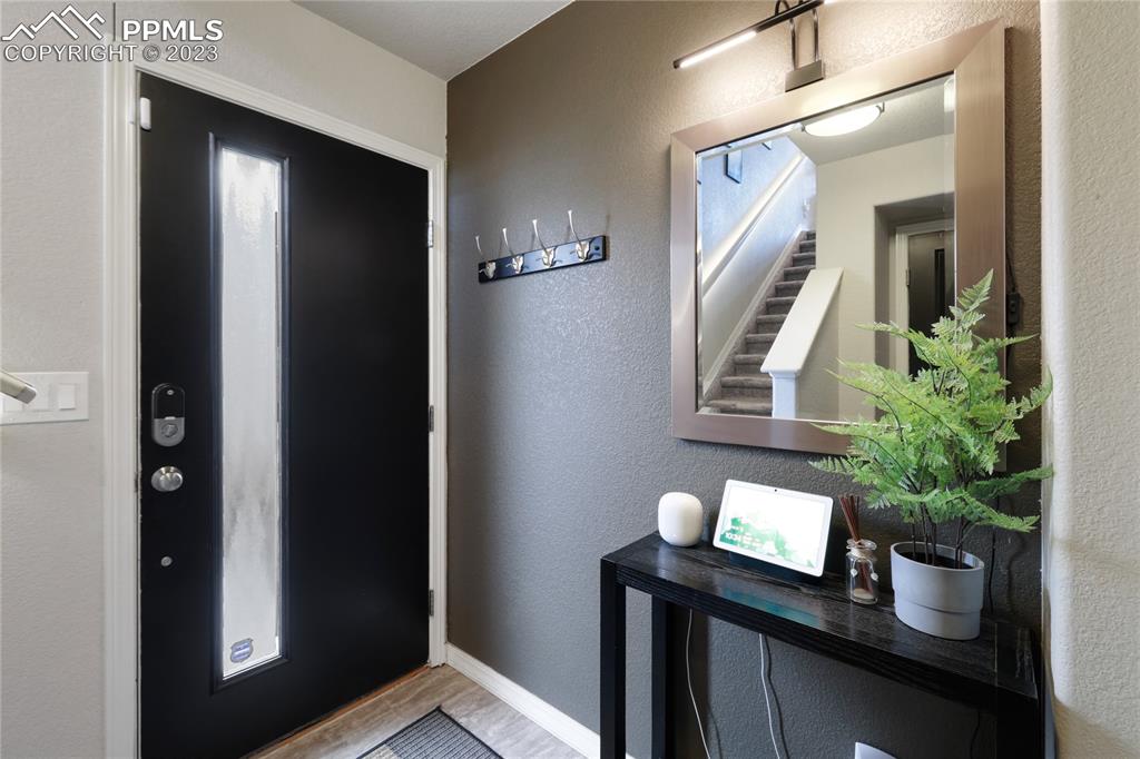 2016 Paddy Grove Colorado Springs, CO 80910 - Photo 4 of 39 a view of bathroom with a potted plant and a mirror