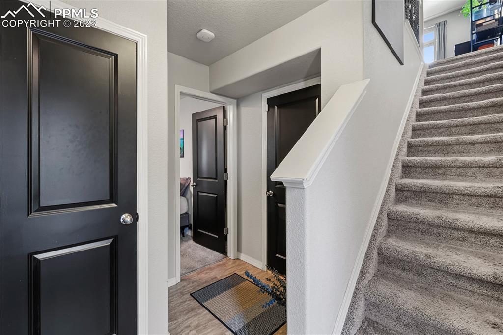 2016 Paddy Grove Colorado Springs, CO 80910 - Photo 5 of 39 a view of entryway and hall with wooden floor