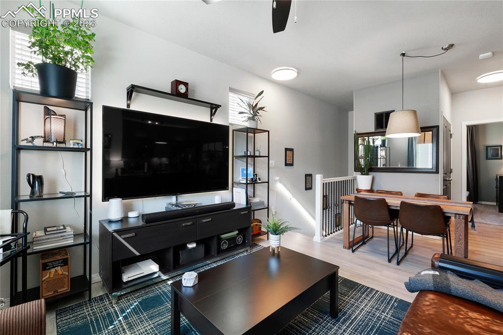 2016 Paddy Grove Colorado Springs, CO 80910 - Photo 6 of 39 a living room with furniture and a flat screen tv