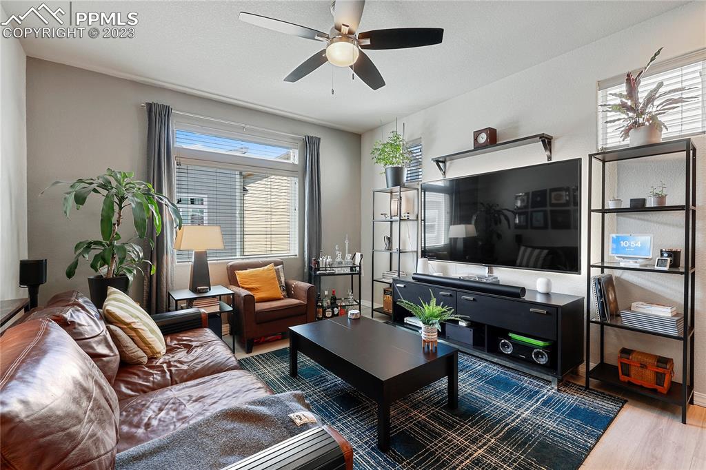 2016 Paddy Grove Colorado Springs, CO 80910 - Photo 7 of 39 a living room with furniture and a flat screen tv