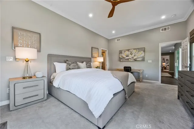 a bed room with a bed and a lamp