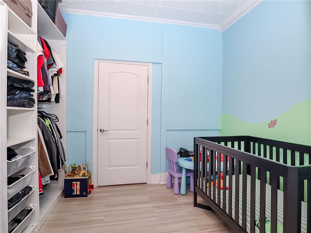124 Hall Street Brooklyn, NY 11205 - Photo 12 of 31 a view of an empty room with wooden floor and a window