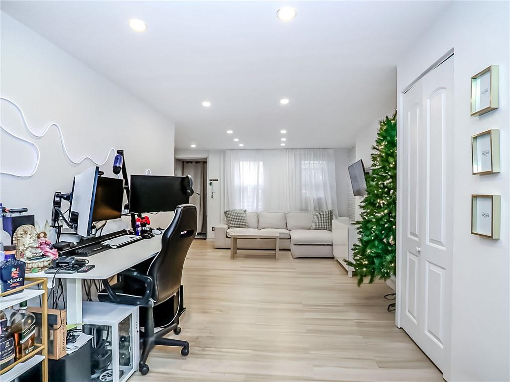 124 Hall Street Brooklyn, NY 11205 - Photo 5 of 31 a living room with furniture and a flat screen tv