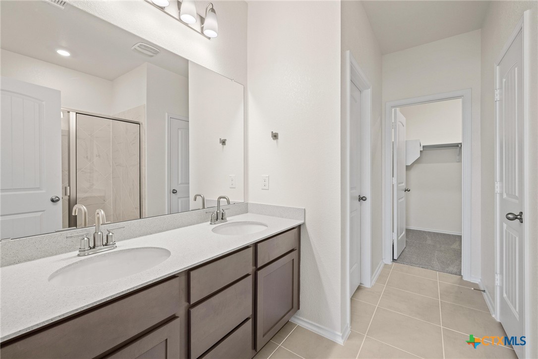 722 Ryan Street Belton, TX 76513 - Photo 17 of 37 Dual-sink vanity and luxurious walk-in shower