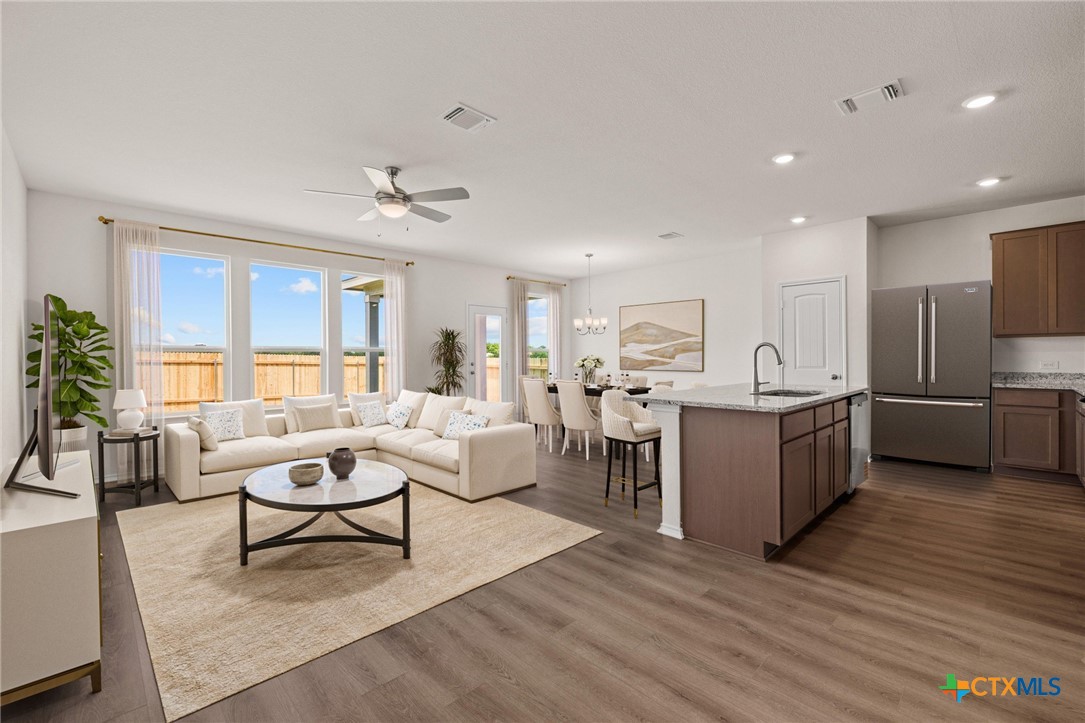 722 Ryan Street Belton, TX 76513 - Photo 5 of 37 Virtually staged living, dining and kitchen