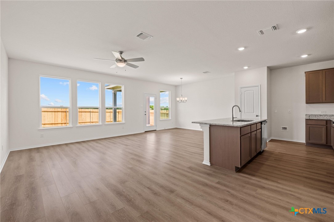 722 Ryan Street Belton, TX 76513 - Photo 6 of 37 Luxury vinyl plank flooring and a spacious great room