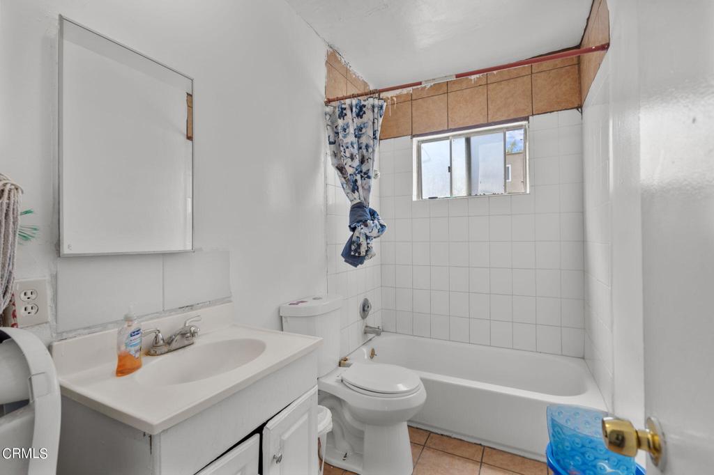 5431 Perkins Road Oxnard, CA 93033 - Photo 14 of 40 a bathroom with a sink a toilet and shower