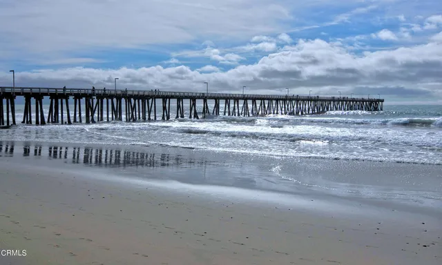 a view of a beach with furniture