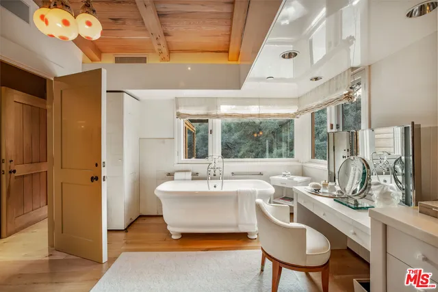 a living room with granite countertop furniture and a chandelier
