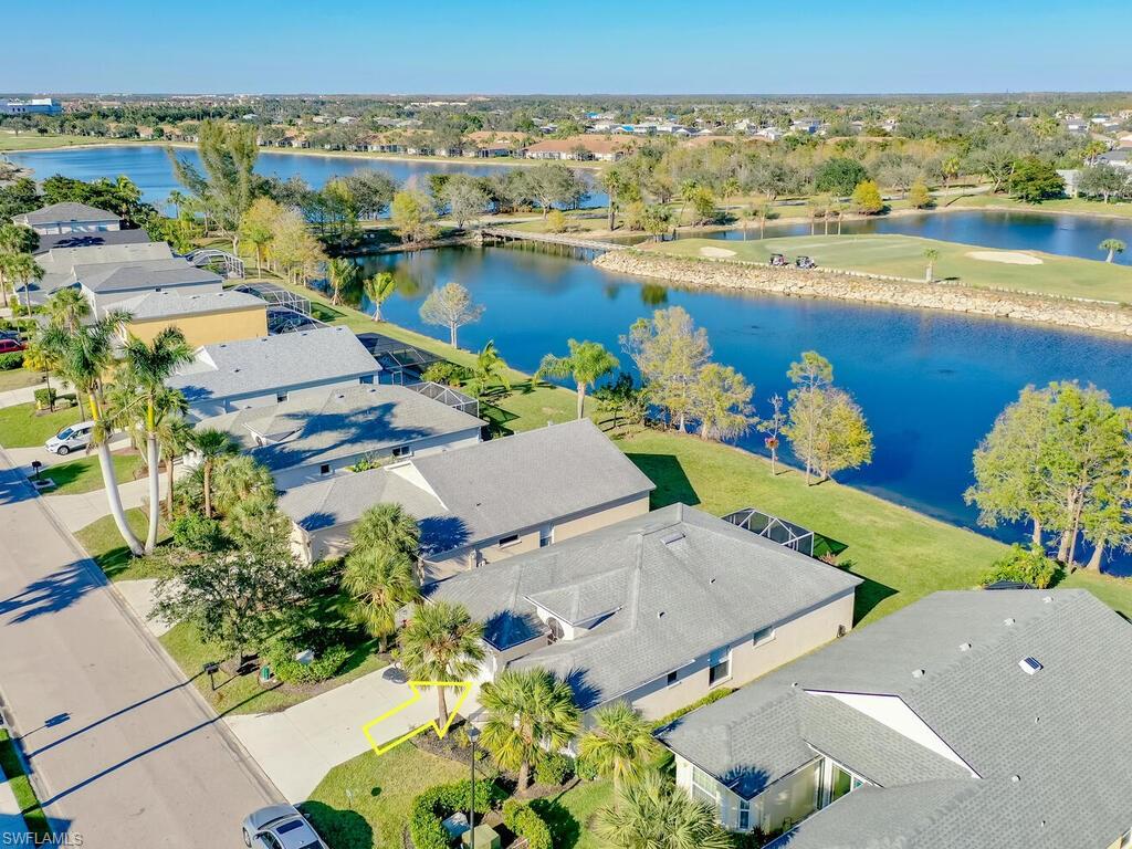 an aerial view of a house with a lake view