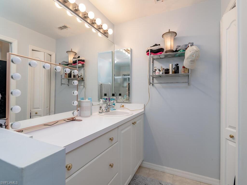 21695 Windham Run Estero, FL 33928 - Photo 11 of 42 a bathroom with a sink and a mirror