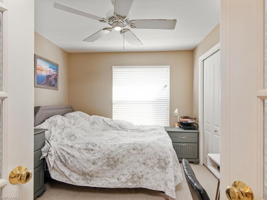 21695 Windham Run Estero, FL 33928 - Photo 12 of 42 a bedroom with a bed and a window