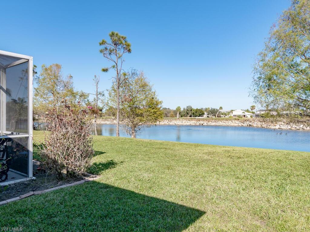 21695 Windham Run Estero, FL 33928 - Photo 18 of 42 a view of a lake with a big yard