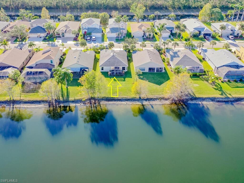 21695 Windham Run Estero, FL 33928 - Photo 25 of 42 an aerial view of residential houses with outdoor space and swimming pool