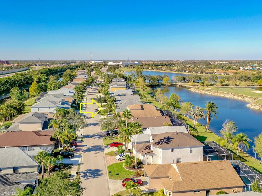 21695 Windham Run Estero, FL 33928 - Photo 26 of 42 an aerial view of residential building and lake