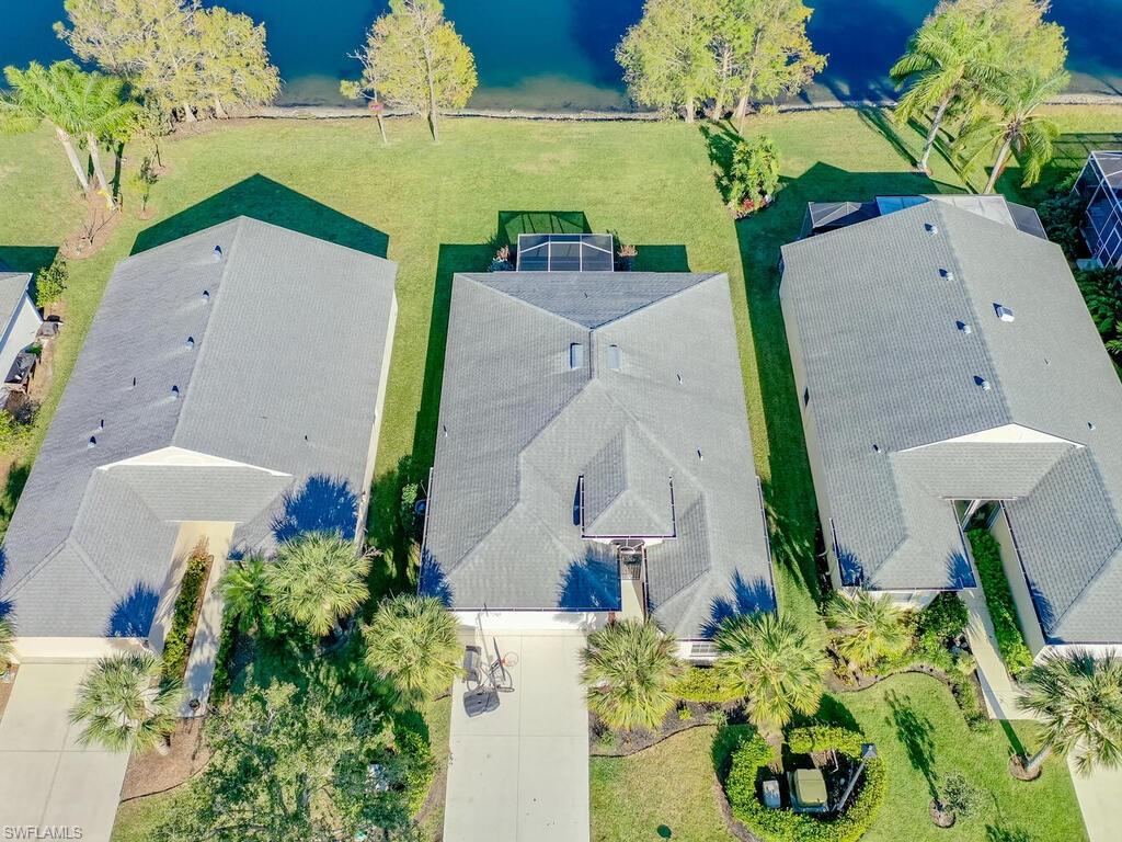 21695 Windham Run Estero, FL 33928 - Photo 27 of 42 an aerial view of a house with a yard and a fountain