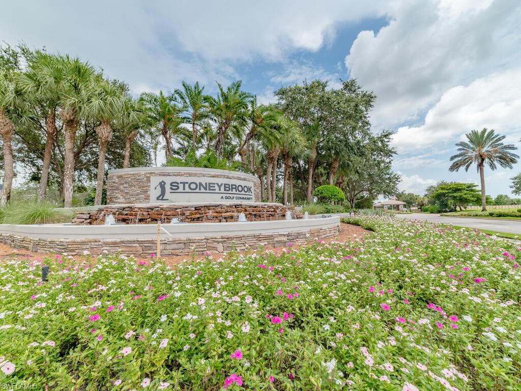 21695 Windham Run Estero, FL 33928 - Photo 29 of 42 a view of swimming pool with a yard and palm trees