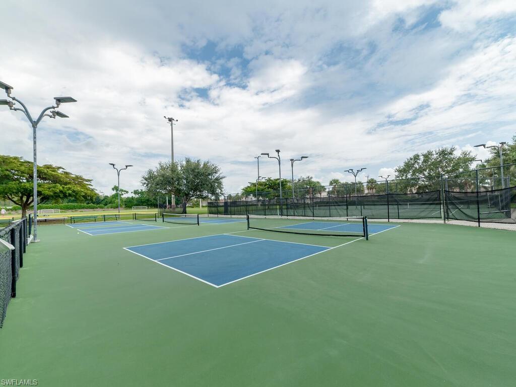 21695 Windham Run Estero, FL 33928 - Photo 36 of 42 a view of a playground and basketball court