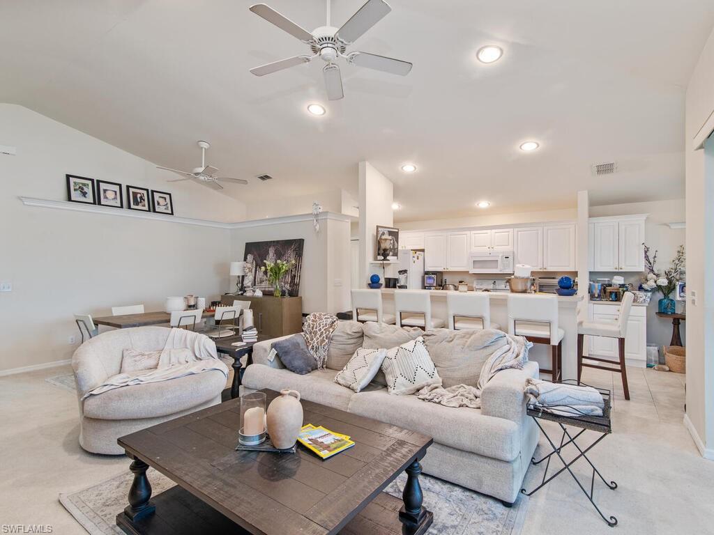 21695 Windham Run Estero, FL 33928 - Photo 4 of 42 a living room with furniture and kitchen view