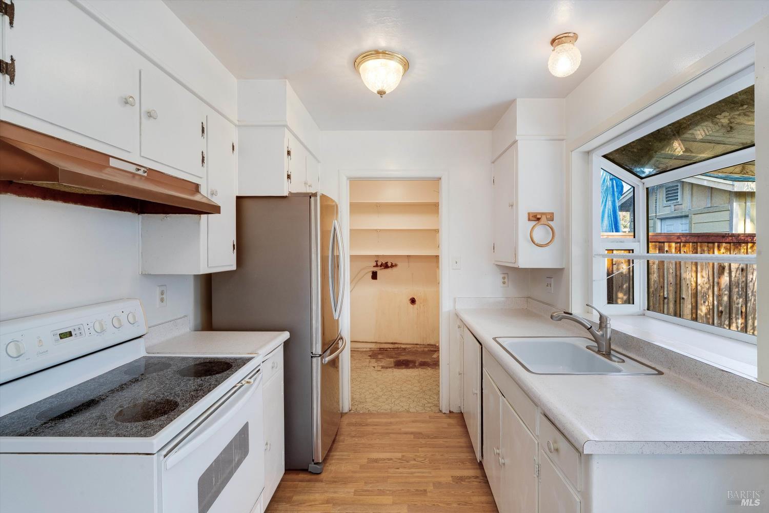 5158 Parkhurst Drive Santa Rosa, CA 95409 - Photo 15 of 40 a kitchen with a sink stove and refrigerator