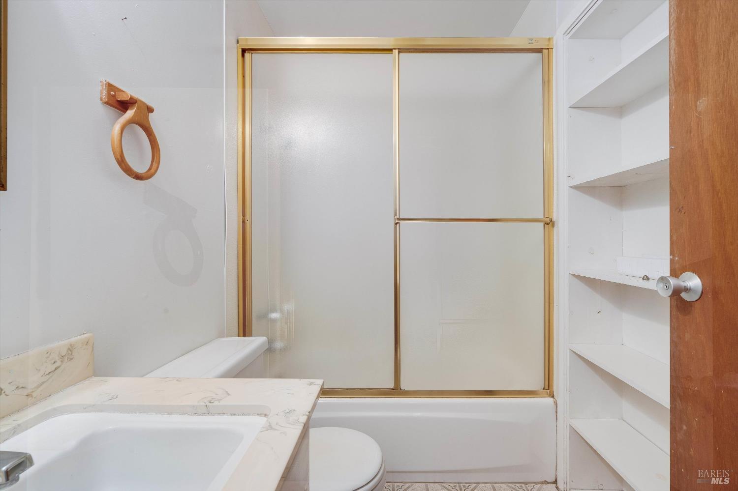 5158 Parkhurst Drive Santa Rosa, CA 95409 - Photo 25 of 40 a bathroom with a sink a toilet and shower