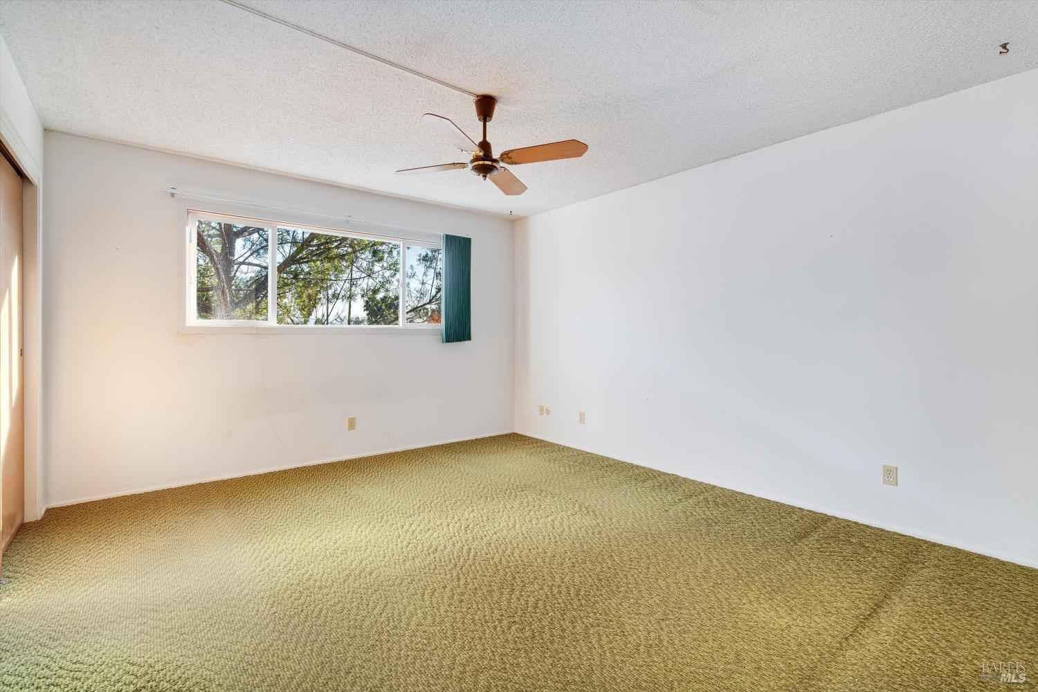 5158 Parkhurst Drive Santa Rosa, CA 95409 - Photo 26 of 40 an empty room with a window