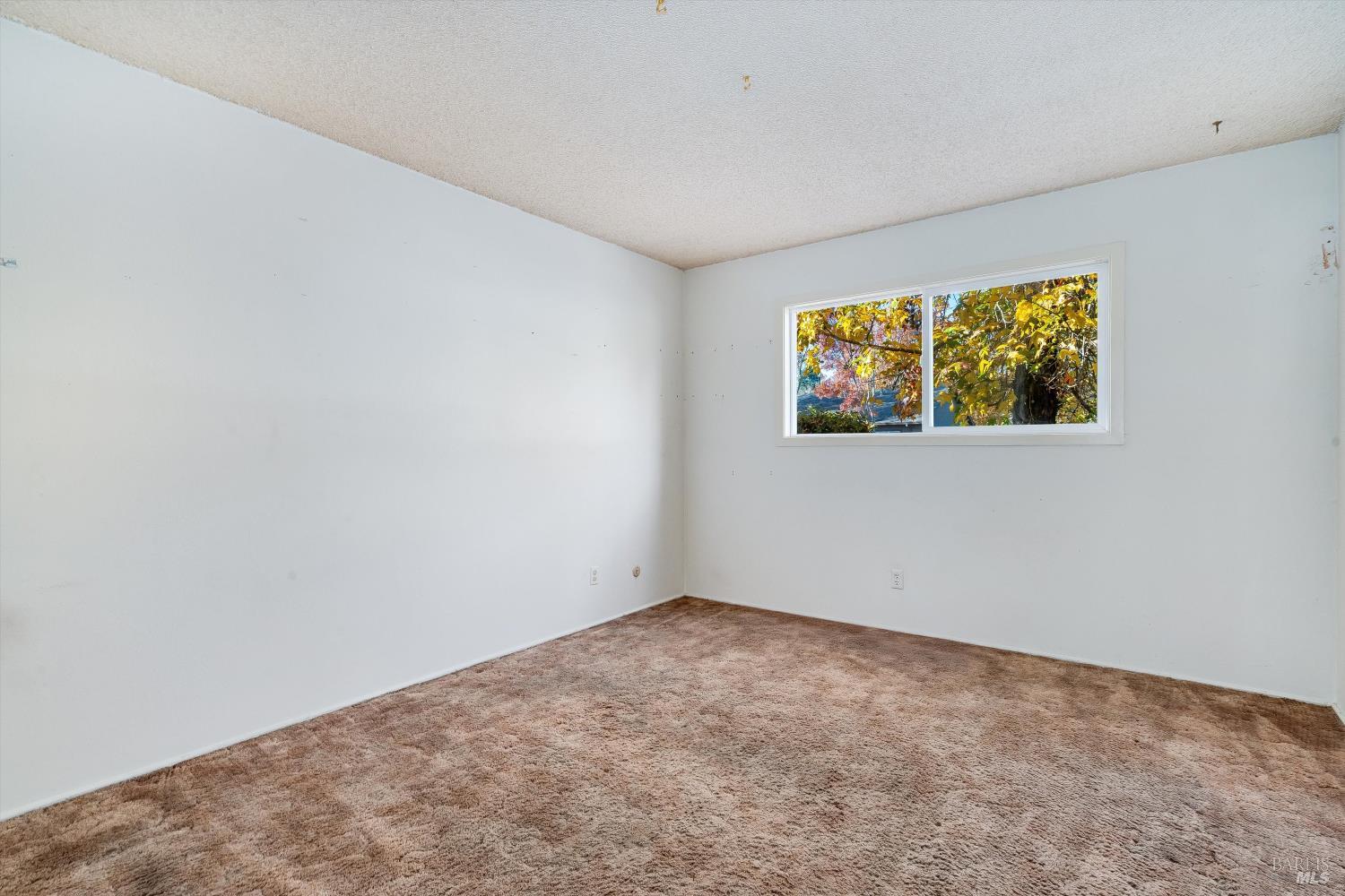 5158 Parkhurst Drive Santa Rosa, CA 95409 - Photo 3 of 40 an empty room with windows