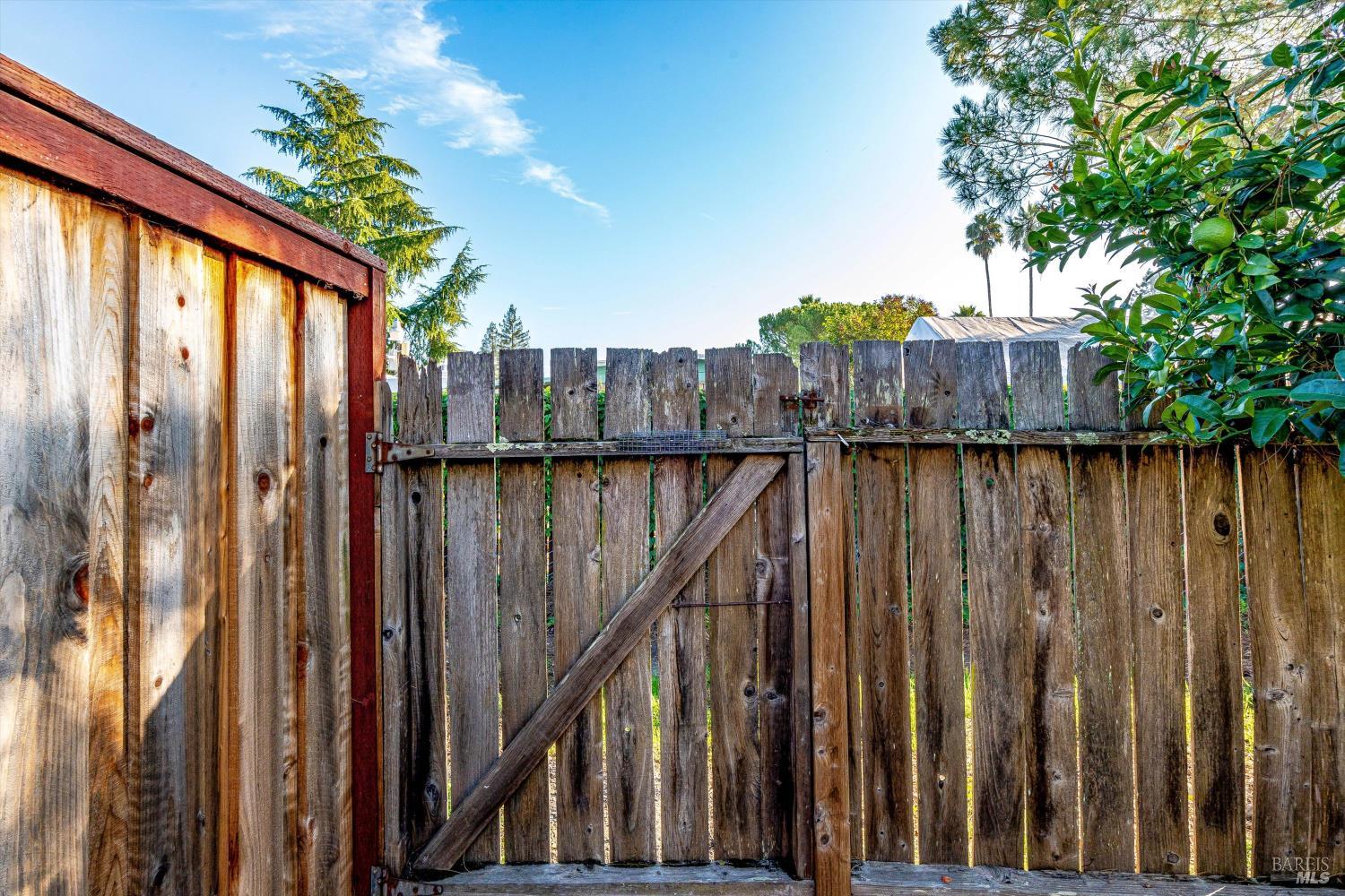 5158 Parkhurst Drive Santa Rosa, CA 95409 - Photo 37 of 40 a view of a building with wooden fence and floor