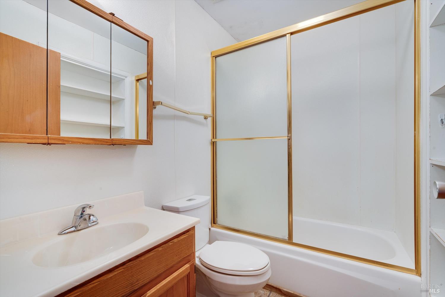 5158 Parkhurst Drive Santa Rosa, CA 95409 - Photo 5 of 40 a bathroom with a sink a toilet and shower