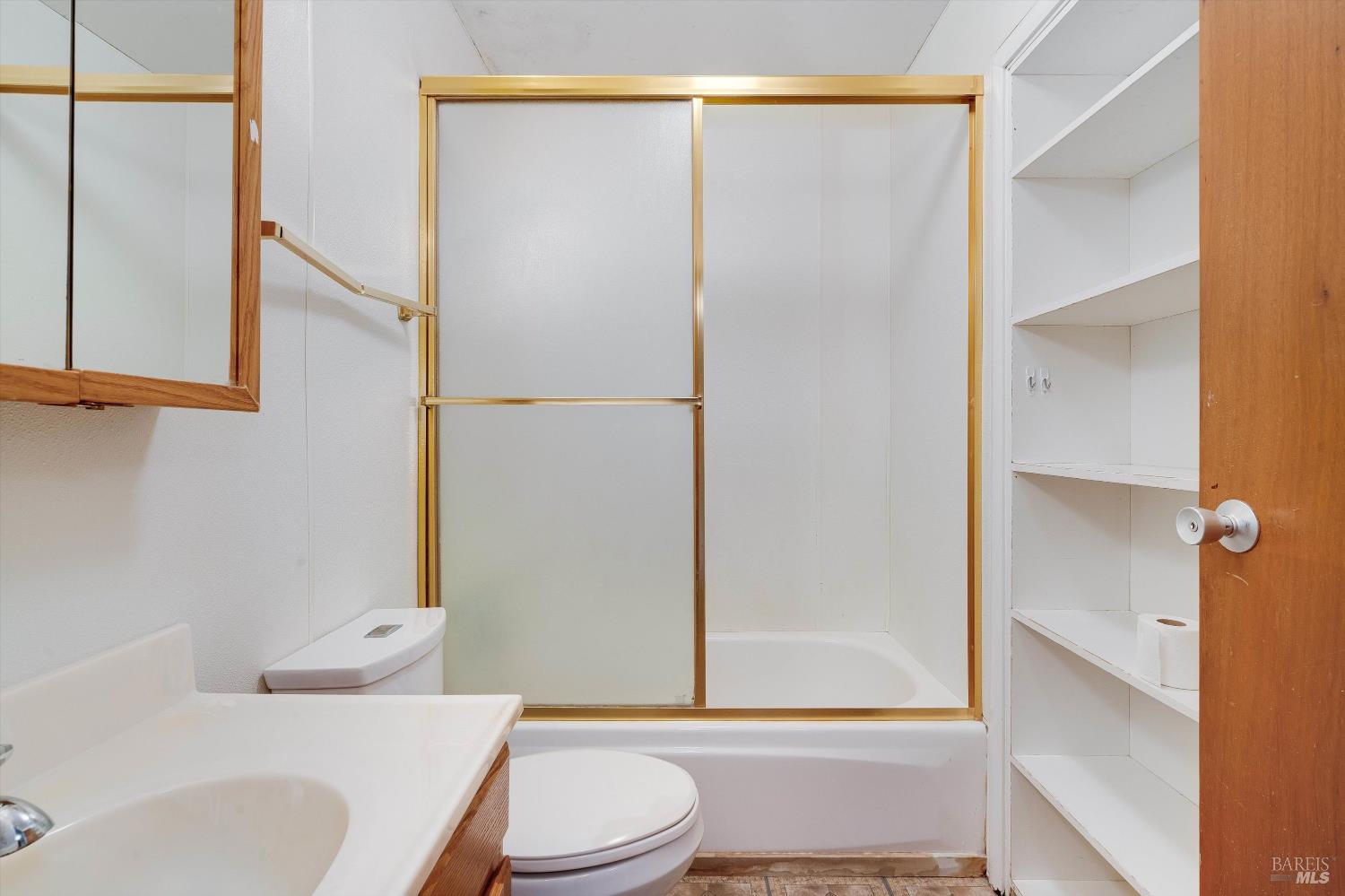 5158 Parkhurst Drive Santa Rosa, CA 95409 - Photo 6 of 40 a bathroom with a bathtub shower sink vanity and toilet