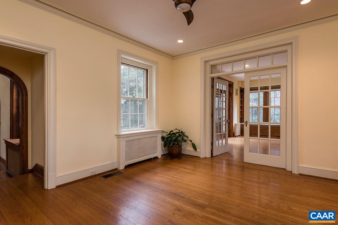 1339 Hilltop Road Charlottesville, VA 22903 - Photo 12 of 24 an empty room with wooden floor and windows