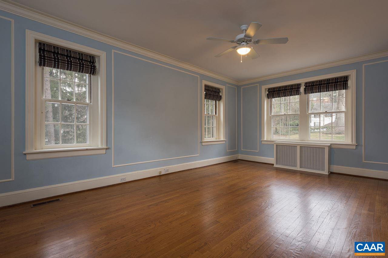 1339 Hilltop Road Charlottesville, VA 22903 - Photo 17 of 24 a view of an empty room with wooden floor and a window
