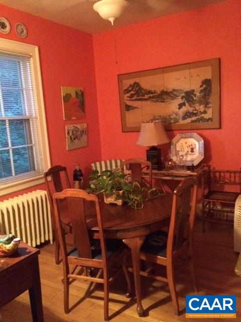 1339 Hilltop Road Charlottesville, VA 22903 - Photo 22 of 24 a view of a dining room with furniture and chandelier
