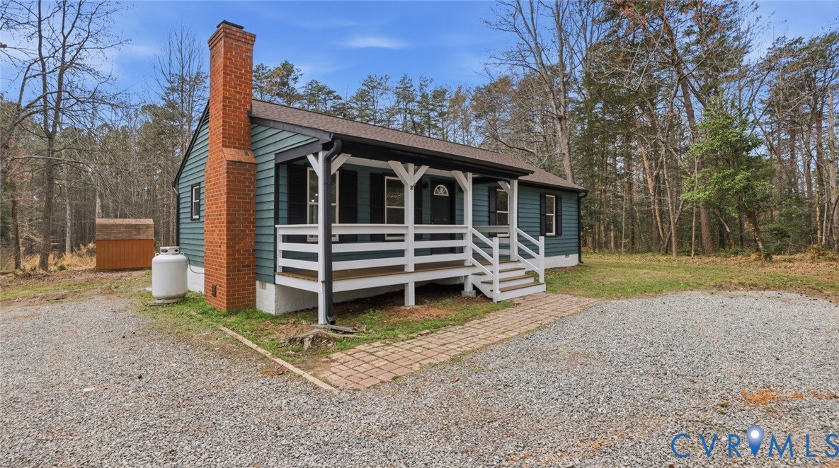 3063 Three Chopt Road Gum Spring, VA 23065 - Photo 1 of 45 a view of a house with backyard
