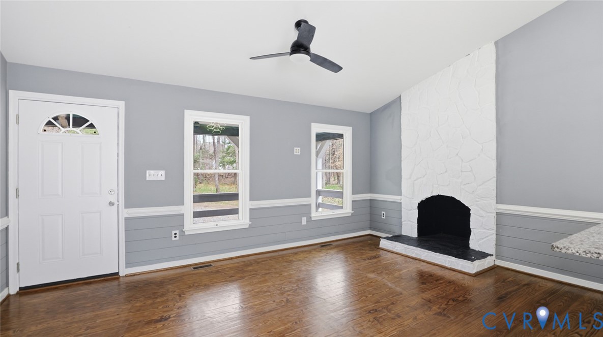 3063 Three Chopt Road Gum Spring, VA 23065 - Photo 12 of 45 a view of an empty room with wooden floor and a window