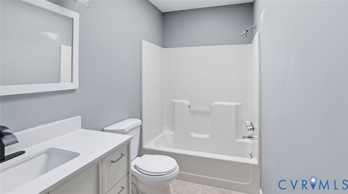 3063 Three Chopt Road Gum Spring, VA 23065 - Photo 20 of 45 a bathroom with a sink a toilet and a bathtub